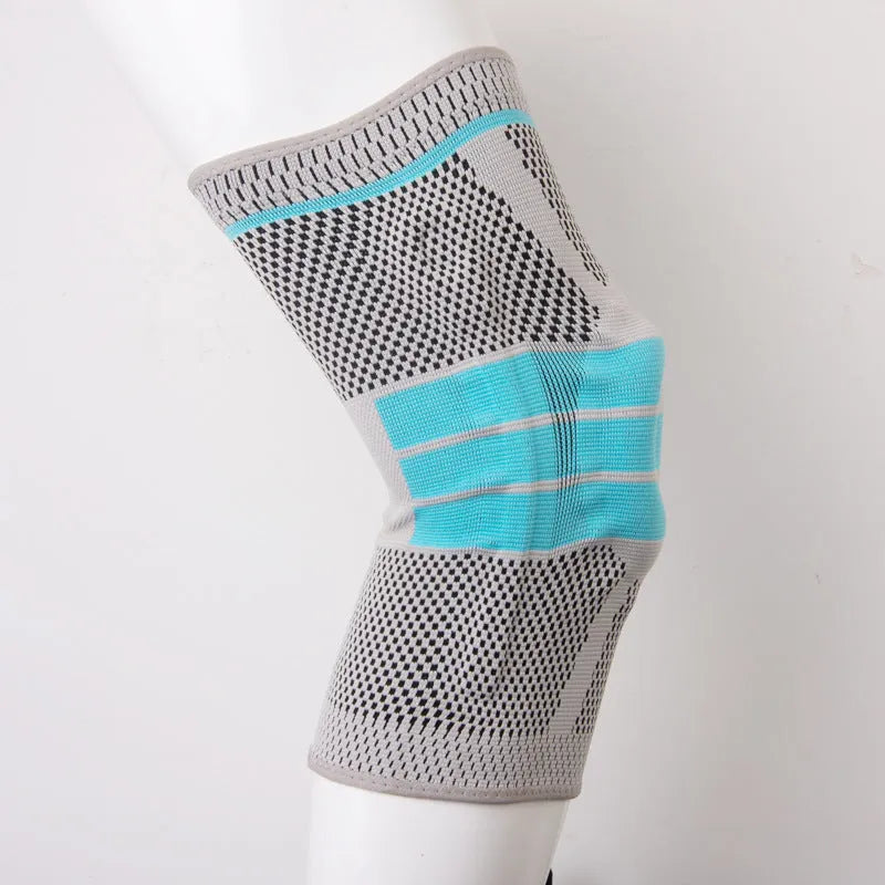 Sky blue elastic fibre knee pad for sports, shown in size S, M, L, or XL.