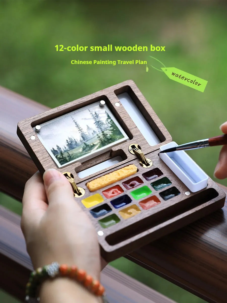 Miniature walnut wood watercolour box with brass fittings and professional paint tubes in leather case