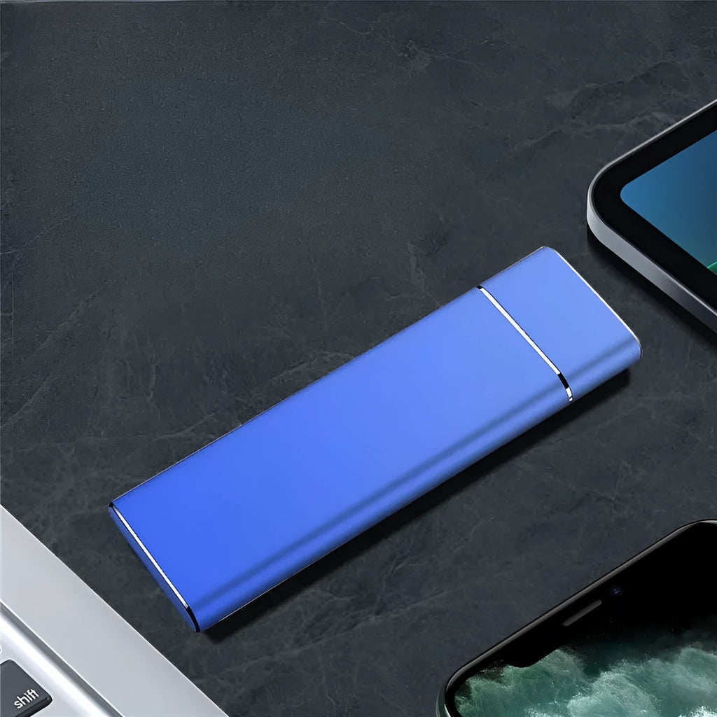 Sapphire blue portable external SSD drive with metal housing next to USB cable