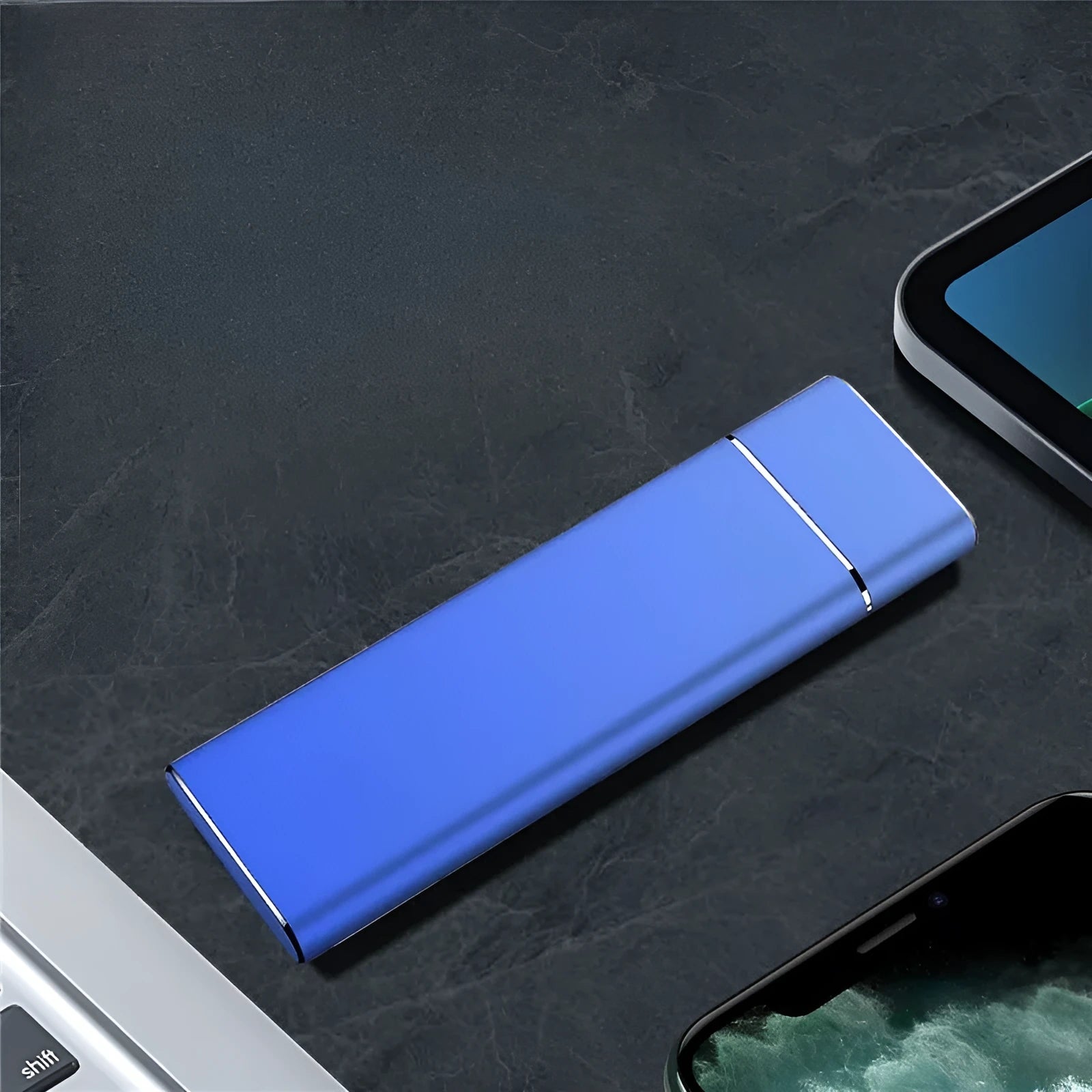 Sapphire blue portable external SSD drive with metal housing next to USB cable