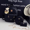 Women's three-piece PU leather bag set showing backpack, crossbody shoulder bag, and card purse in matching colour.