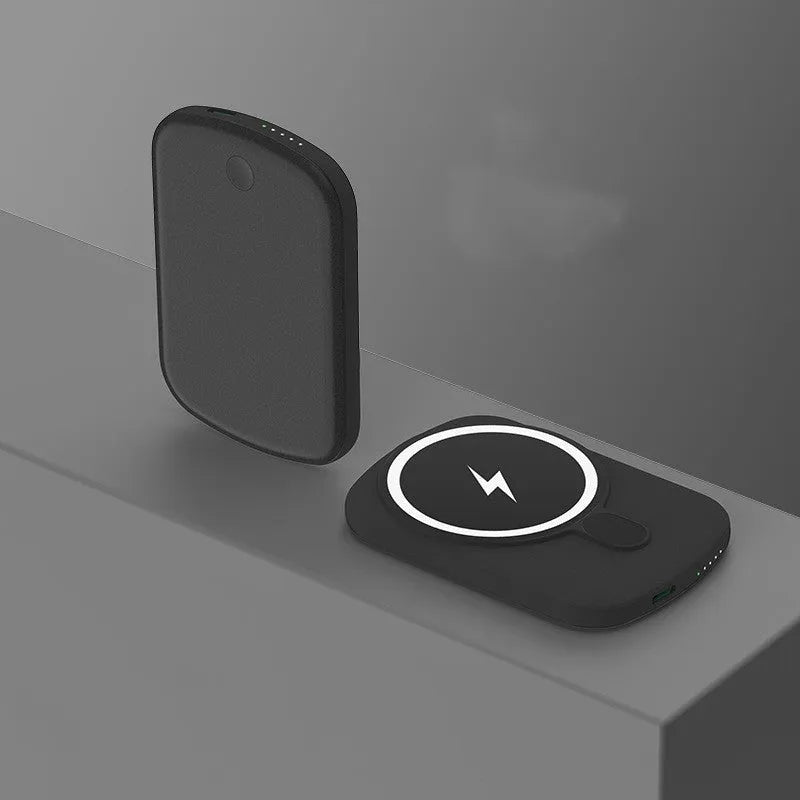 Magsafe magnetic wireless power bank in four colours: black, purple, pink, and white, next to an iPhone.