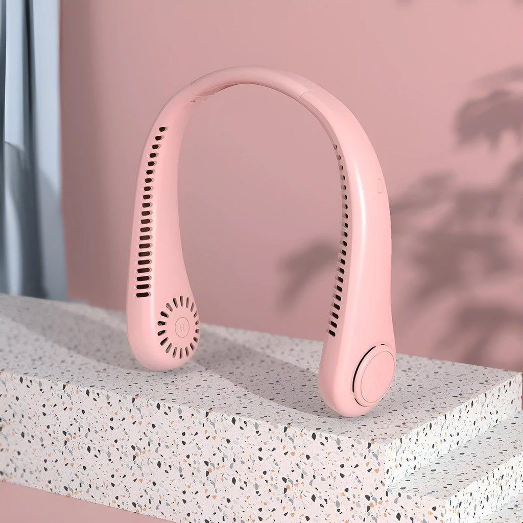 Pink bladeless neck fan worn around neck with USB charging cable