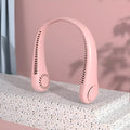 Pink bladeless neck fan worn around neck with USB charging cable