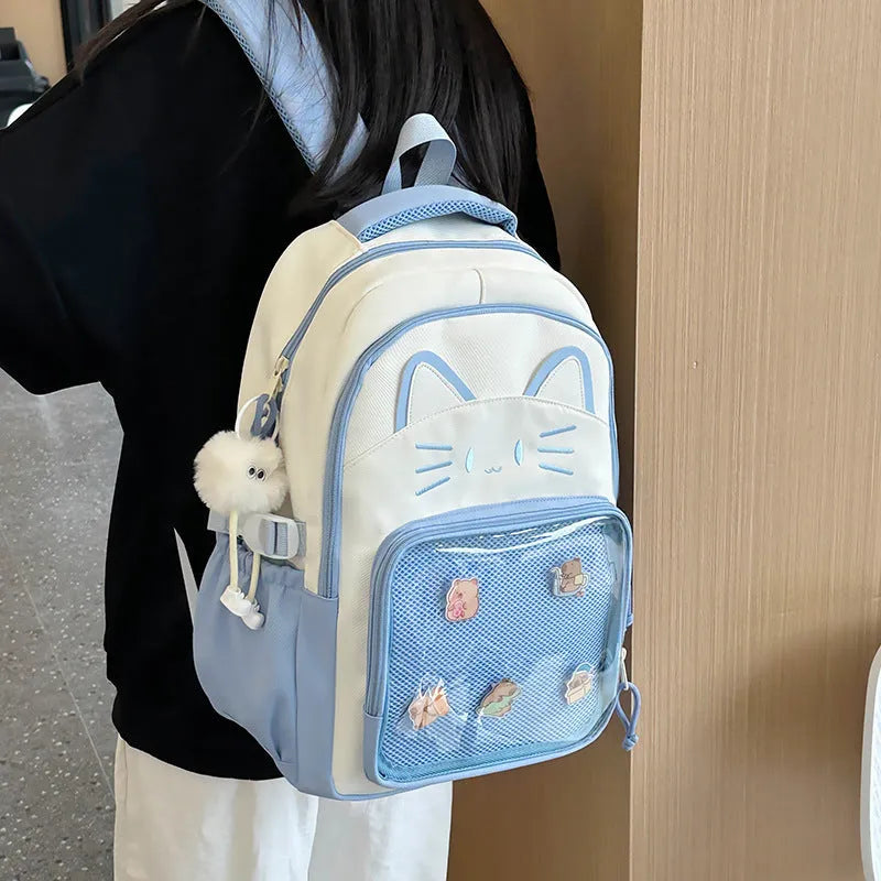 Korean cartoon pattern large backpack in multiple colours with curved straps and badge pendant option.