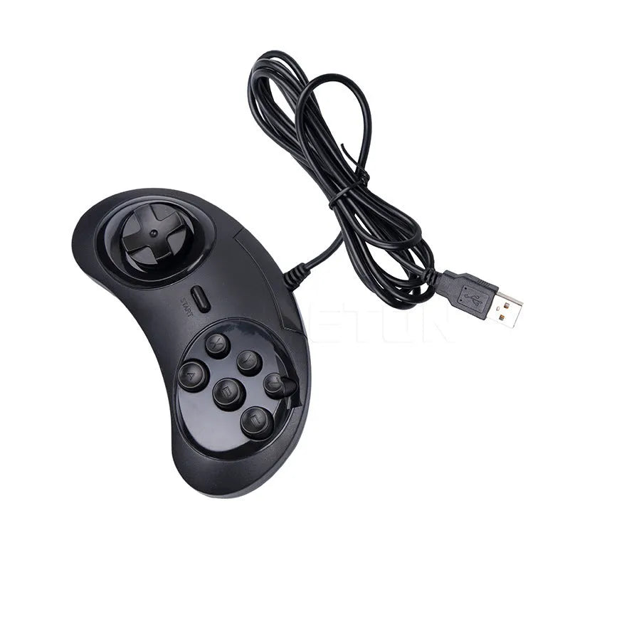 Black Sega USB PC gaming controller with long cable on a desk.