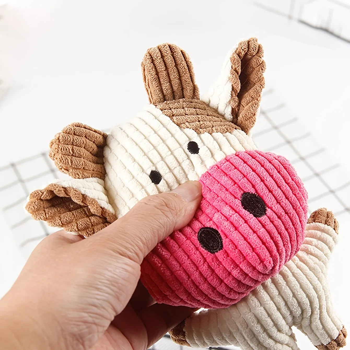 Animal shape plush dog chew toy in multiple colours with bite resistant construction