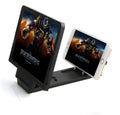 Black foldable mobile phone stand with 3D screen amplifier showing phone in viewing position