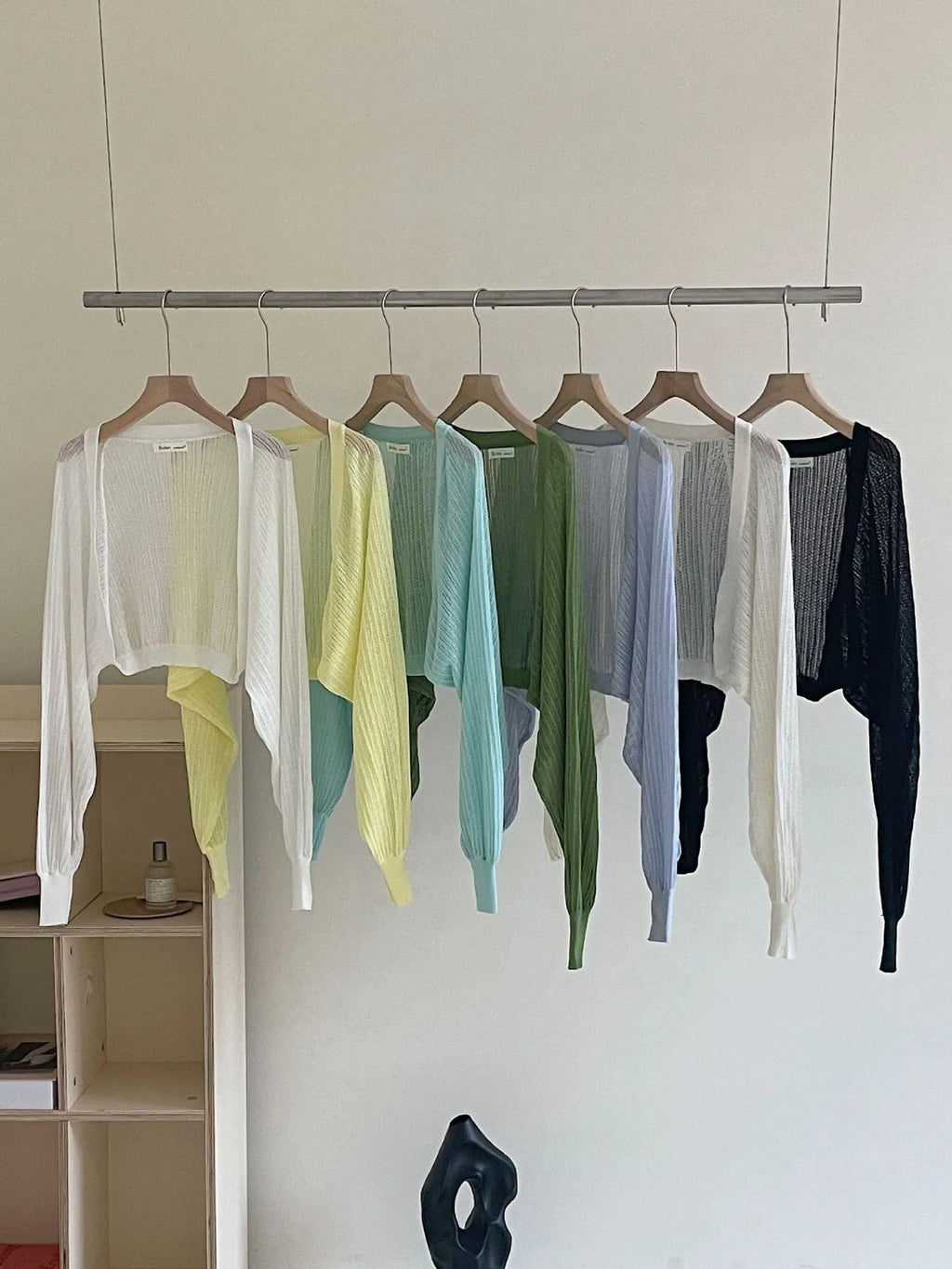 Thin polyester blouse with long hollow lantern sleeves in apricot colour, slim fit.