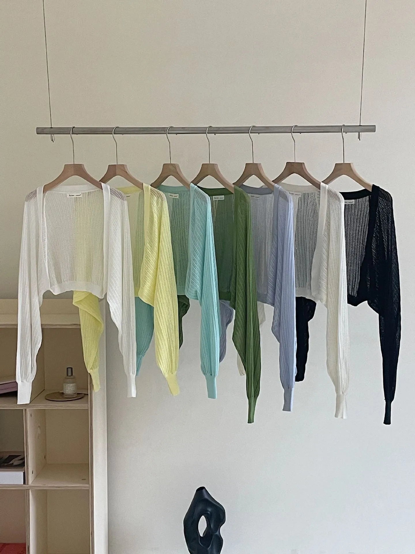 Thin polyester blouse with long hollow lantern sleeves in apricot colour, slim fit.