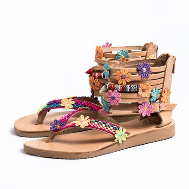 Women's ethnic style beaded petal floral roman sandals with round toe and PU upper.