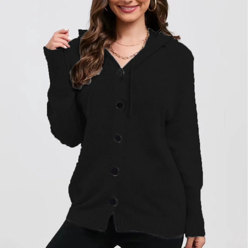 A woman wearing a loose-fit, hooded, solid-colour cotton cardigan sweater in a neutral tone.