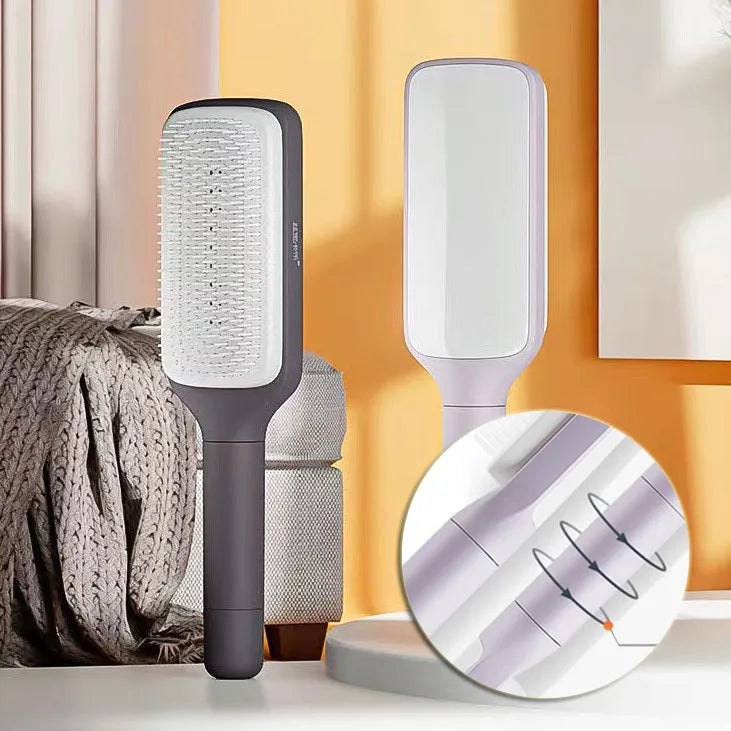 Roland purple self-cleaning hair brush with ergonomic handle showing rotating mechanism.