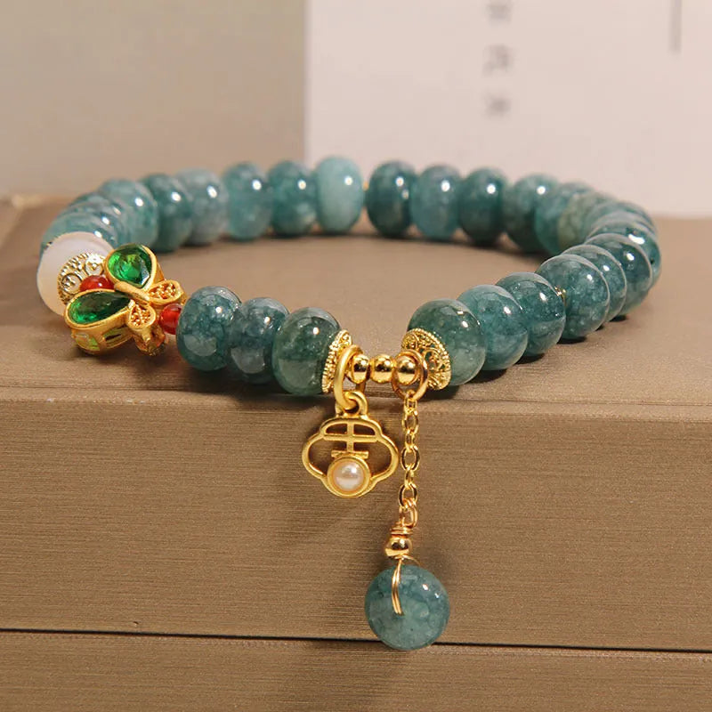 Women's blue water jade abacus bead bracelet with alloy inlay and butterfly charms