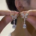 Bow-shaped stud earrings with electroplated platinum finish on zinc alloy