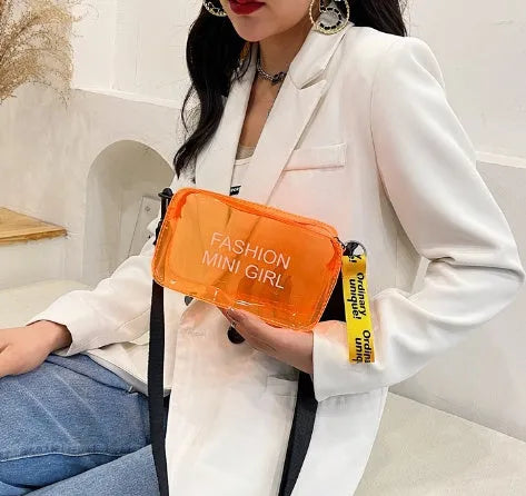 Transparent square jelly shoulder bag with adjustable strap showing internal mobile phone compartment
