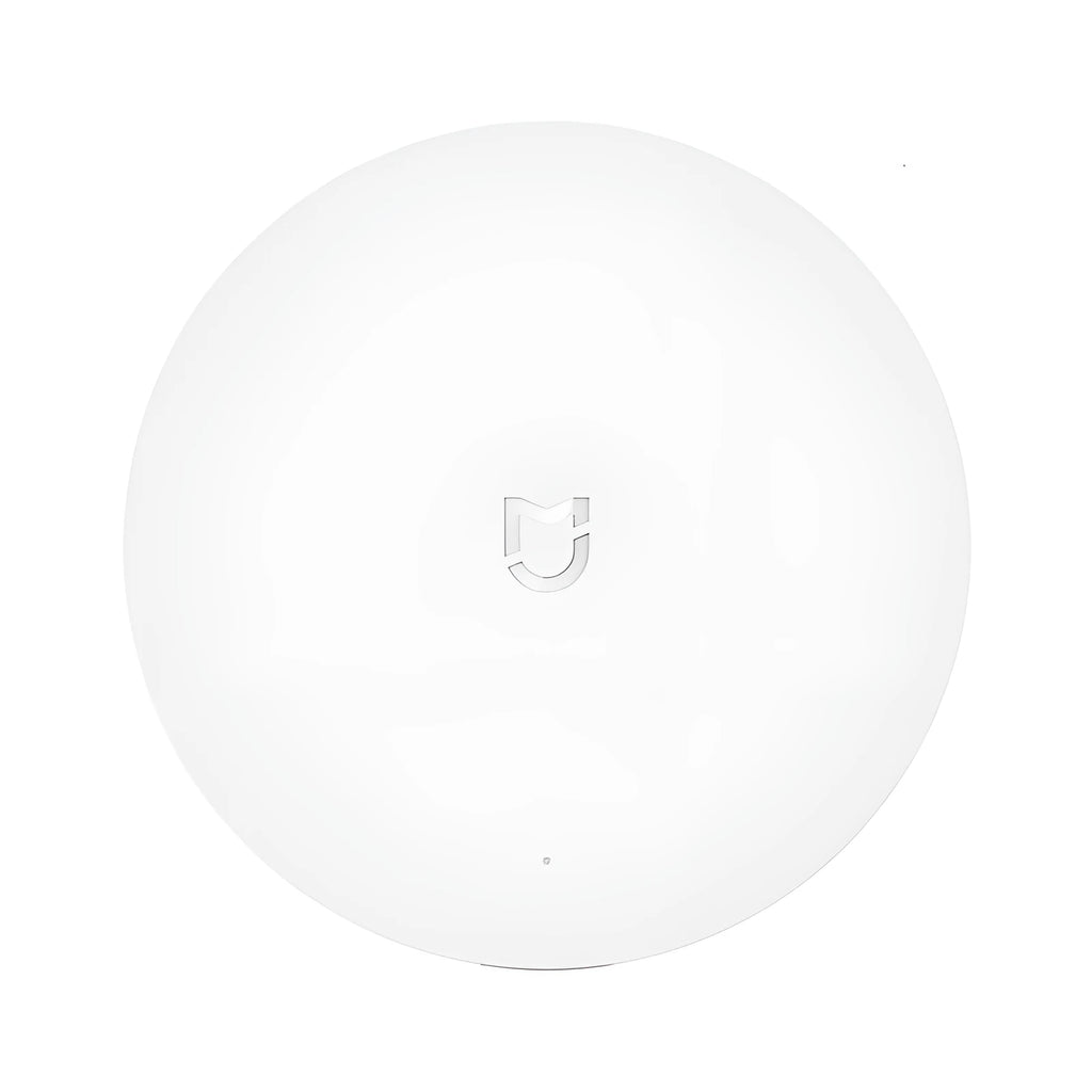 White circular Xiaomi Mijia smart home gateway with UK plug for wireless device control