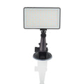 Black aluminium USB LED video conference light with LCD screen, shown next to a laptop