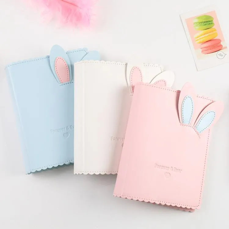 Cute rabbit-themed mini photo album with PU cover in blue, pink, or white, showing loose-leaf pages.