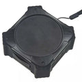 Small black waterproof portable Bluetooth speaker with a wrist strap lanyard.