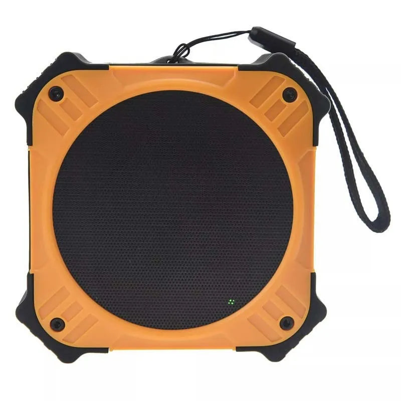 Small black waterproof portable Bluetooth speaker with a wrist strap lanyard.