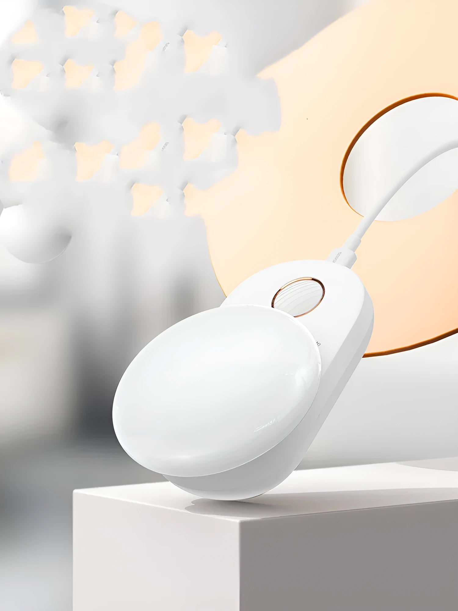 White circular rechargeable sensor night light with warm LED illumination for bedside placement