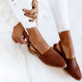 Women's pointed toe baotou flat sandals with a buckle closure, shown in one of six available colours.