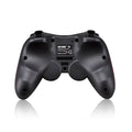 Black wireless Bluetooth gamepad controller for mobile phones on a table next to a charging cable.