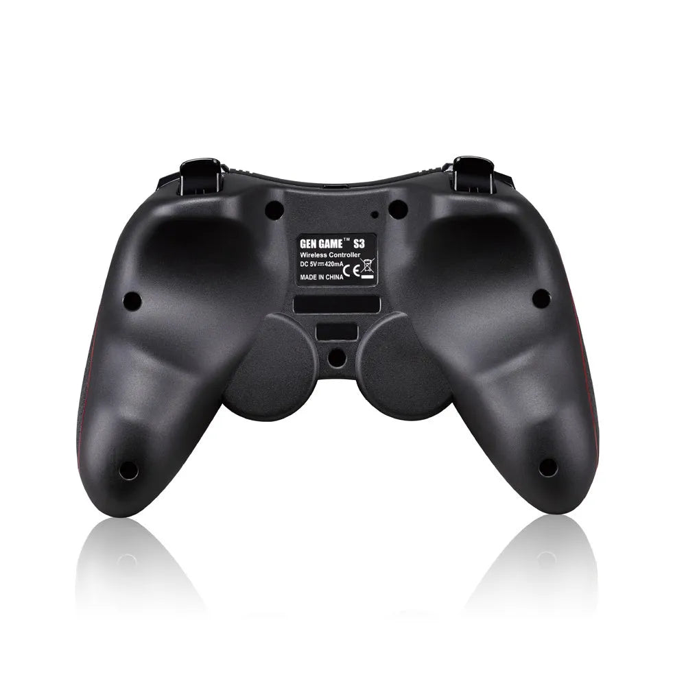 Black wireless Bluetooth gamepad controller for mobile phones on a table next to a charging cable.