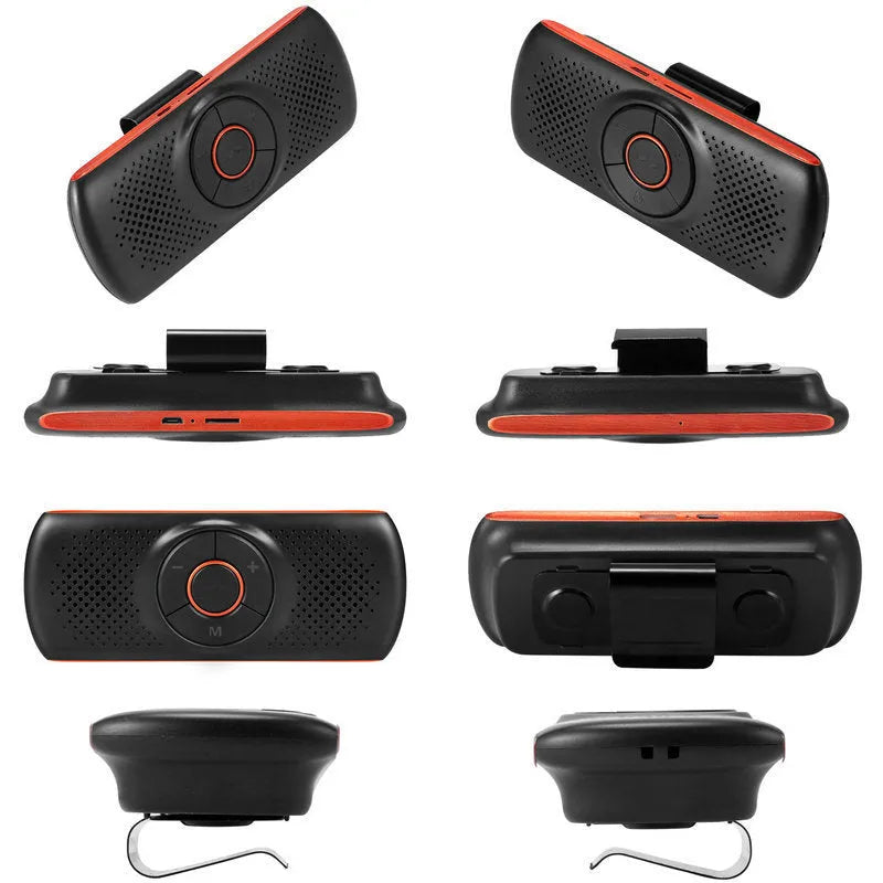 Orange Bluetooth car hands-free speaker unit clipped to a car sun visor.