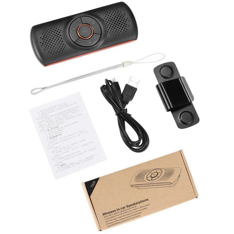 Orange Bluetooth car hands-free speaker unit clipped to a car sun visor.