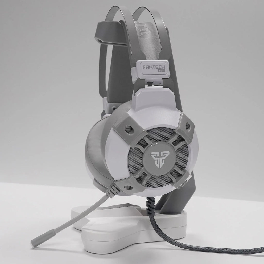 Black FANTECH HG11 gaming headset with RGB lights, large ear cups, and a noise-cancelling microphone on a flexible boom.