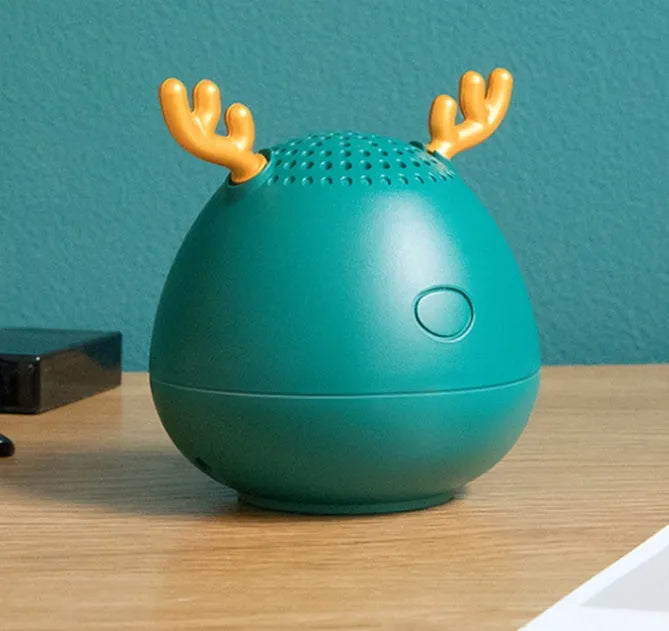 Small portable Bluetooth speaker in white pink or green colours with USB charging port