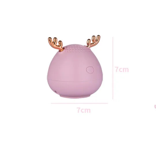 Small portable Bluetooth speaker in white pink or green colours with USB charging port