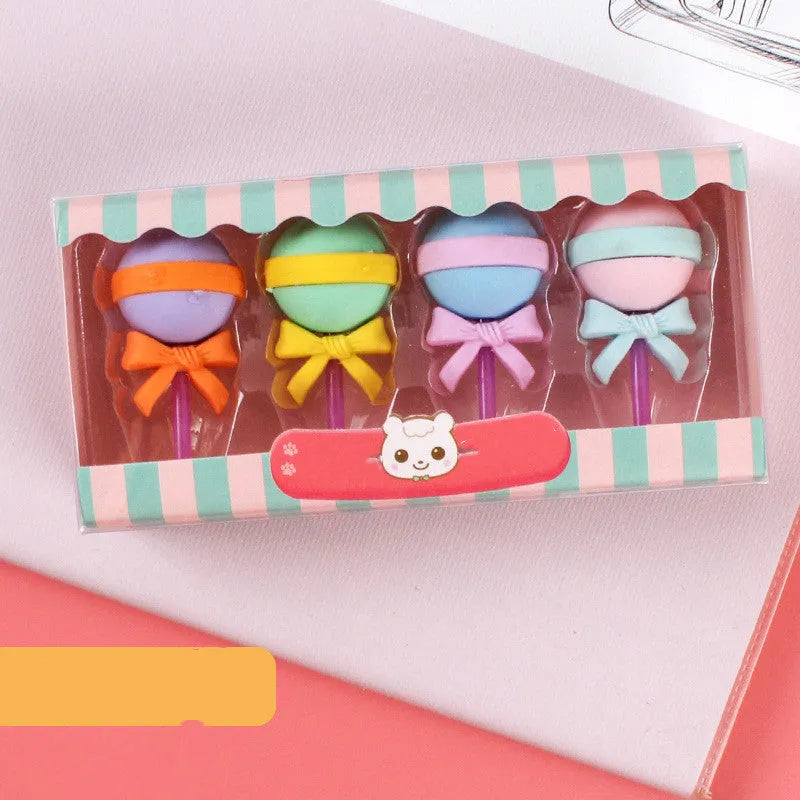 Set of 12 colourful cartoon food erasers including ice cream cones, donuts, and lollipops.