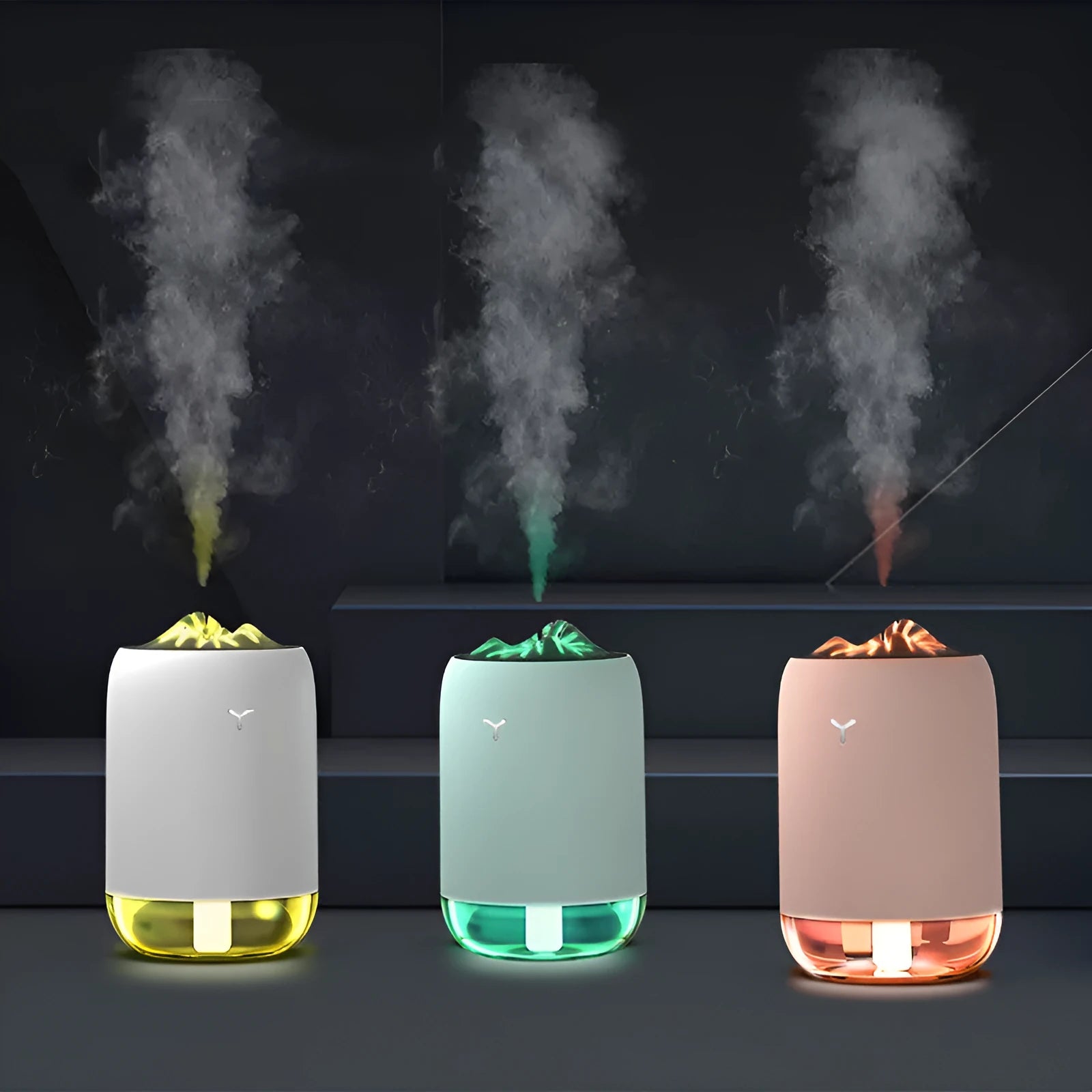 White columnar Magic Flame ultrasonic humidifier with USB cable and water tank on a wooden desk.