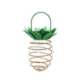 Outdoor waterproof green pineapple solar path light with 20 warm white LEDs and metal frame on a garden table