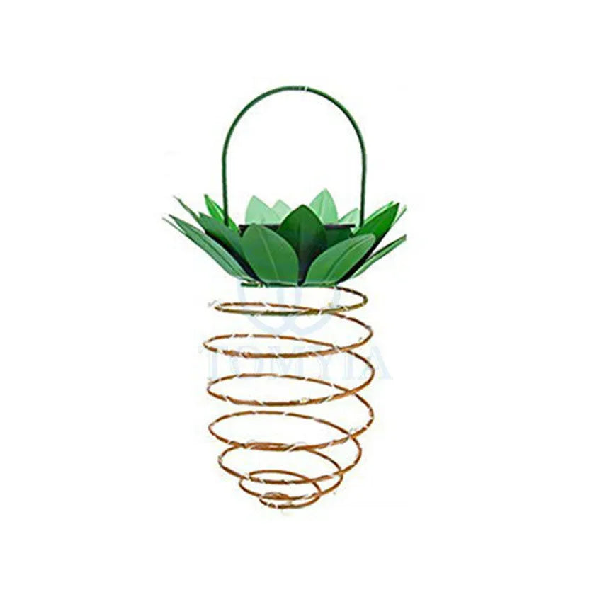 Outdoor waterproof green pineapple solar path light with 20 warm white LEDs and metal frame on a garden table