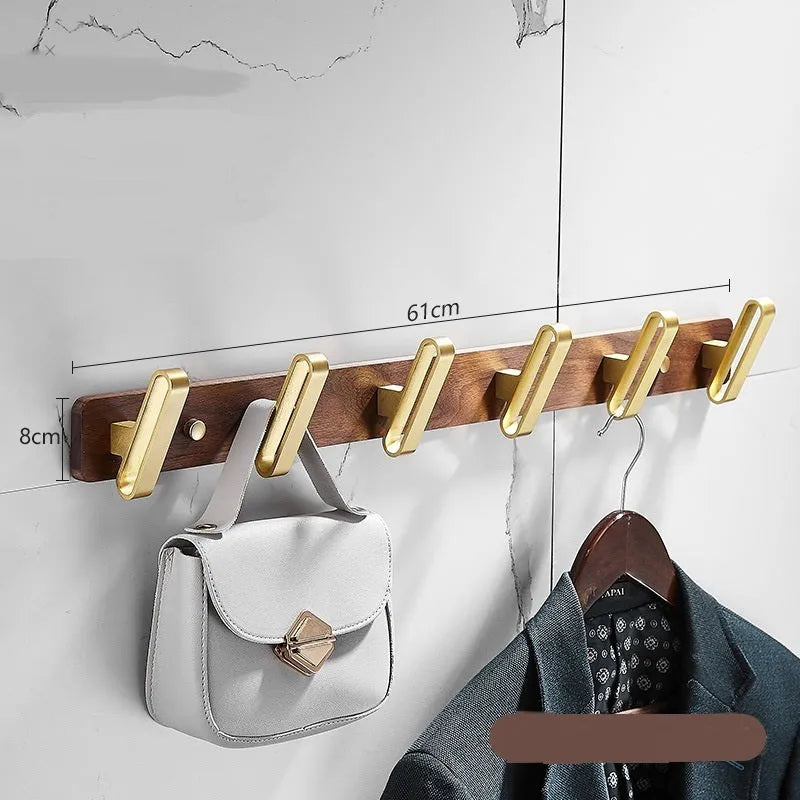 Black walnut aluminium bathroom clothes hooks with brass wire drawing accents on perforated mounting plate