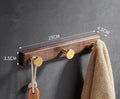 Black walnut aluminium bathroom clothes hooks with brass wire drawing accents on perforated mounting plate