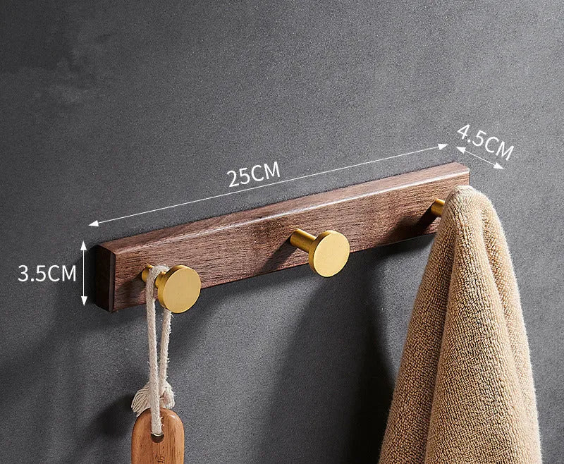 Black walnut aluminium bathroom clothes hooks with brass wire drawing accents on perforated mounting plate