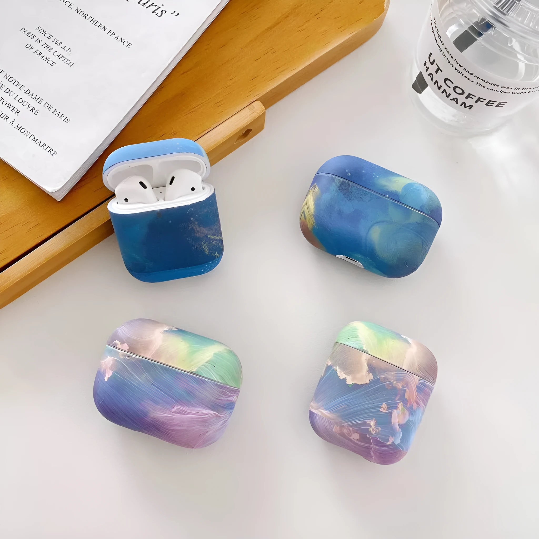 Hard plastic protective case for AirPods Pro with watercolour design in blue colour