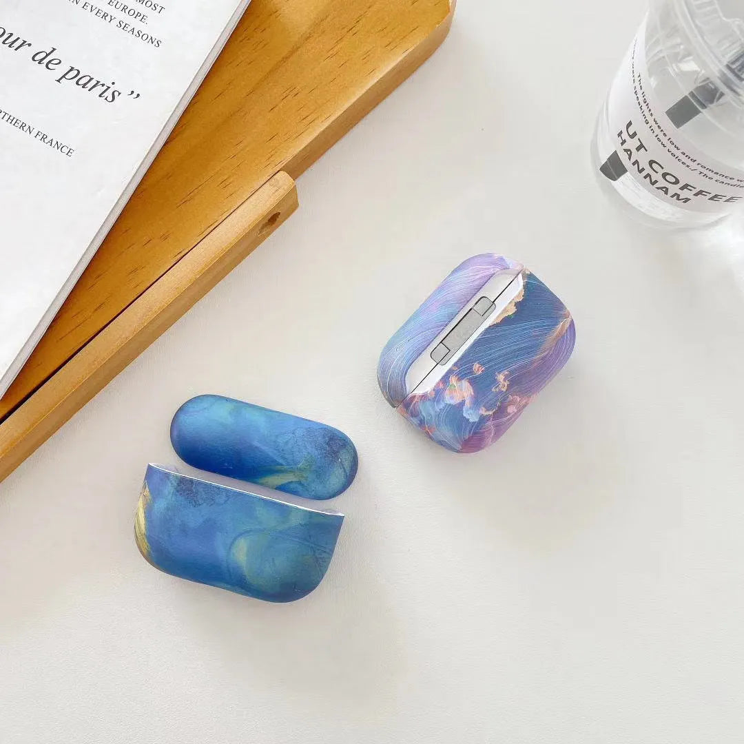 Hard plastic protective case for AirPods Pro with watercolour design in blue colour