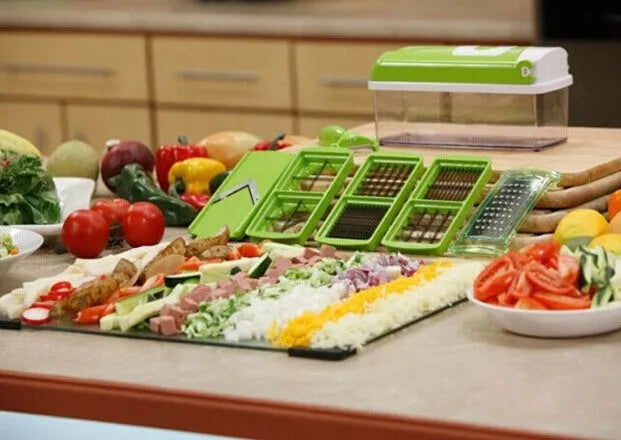 Green 12-piece manual vegetable chopper set with stainless steel blades on kitchen counter