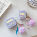 Purple silicone Apple AirPods protective case with attached fur ball pendant on white background