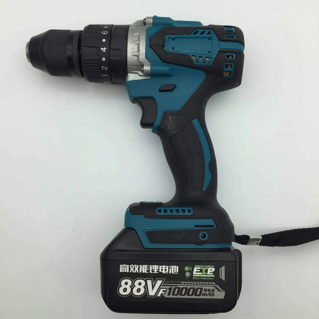 21V black and orange cordless impact drill with lithium battery pack on a workbench.