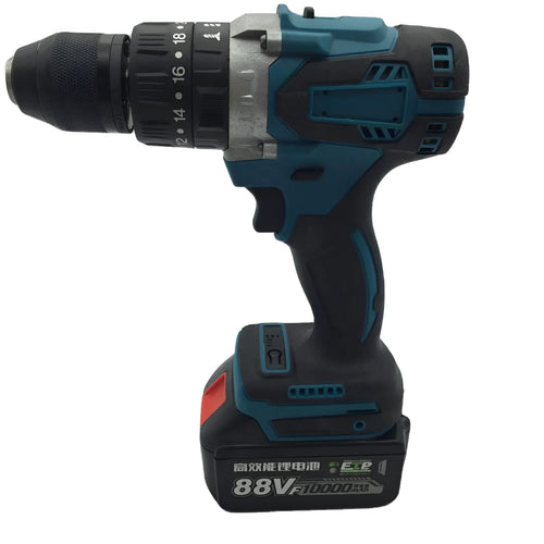 21V black and orange cordless impact drill with lithium battery pack on a workbench.