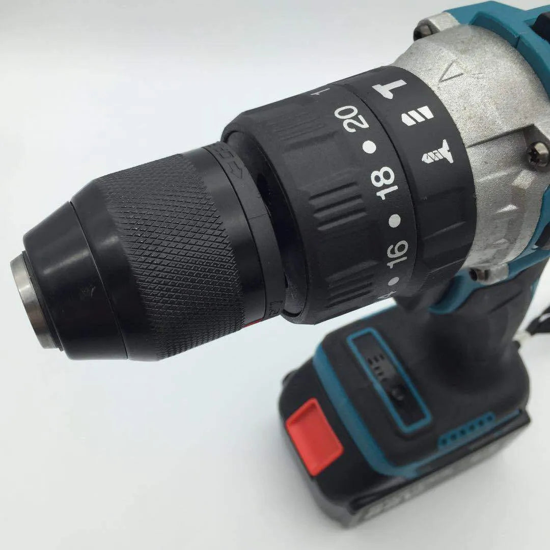 21V black and orange cordless impact drill with lithium battery pack on a workbench.