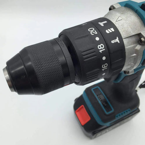 21V black and orange cordless impact drill with lithium battery pack on a workbench.
