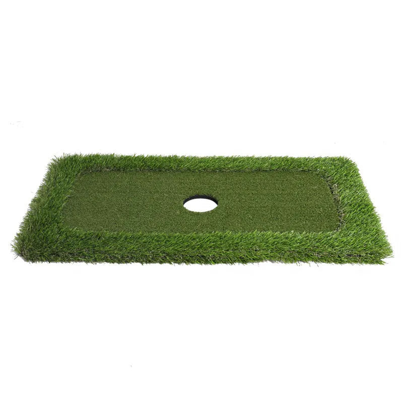 Green rectangular golf practice mat with a textured grass-like surface on a cushioned base.